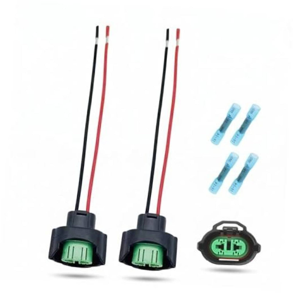 2 female headlight wiring harness connectors with red/black wires and green terminals