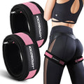 Pink and black fabric booty bands with metal buckles, shown on model