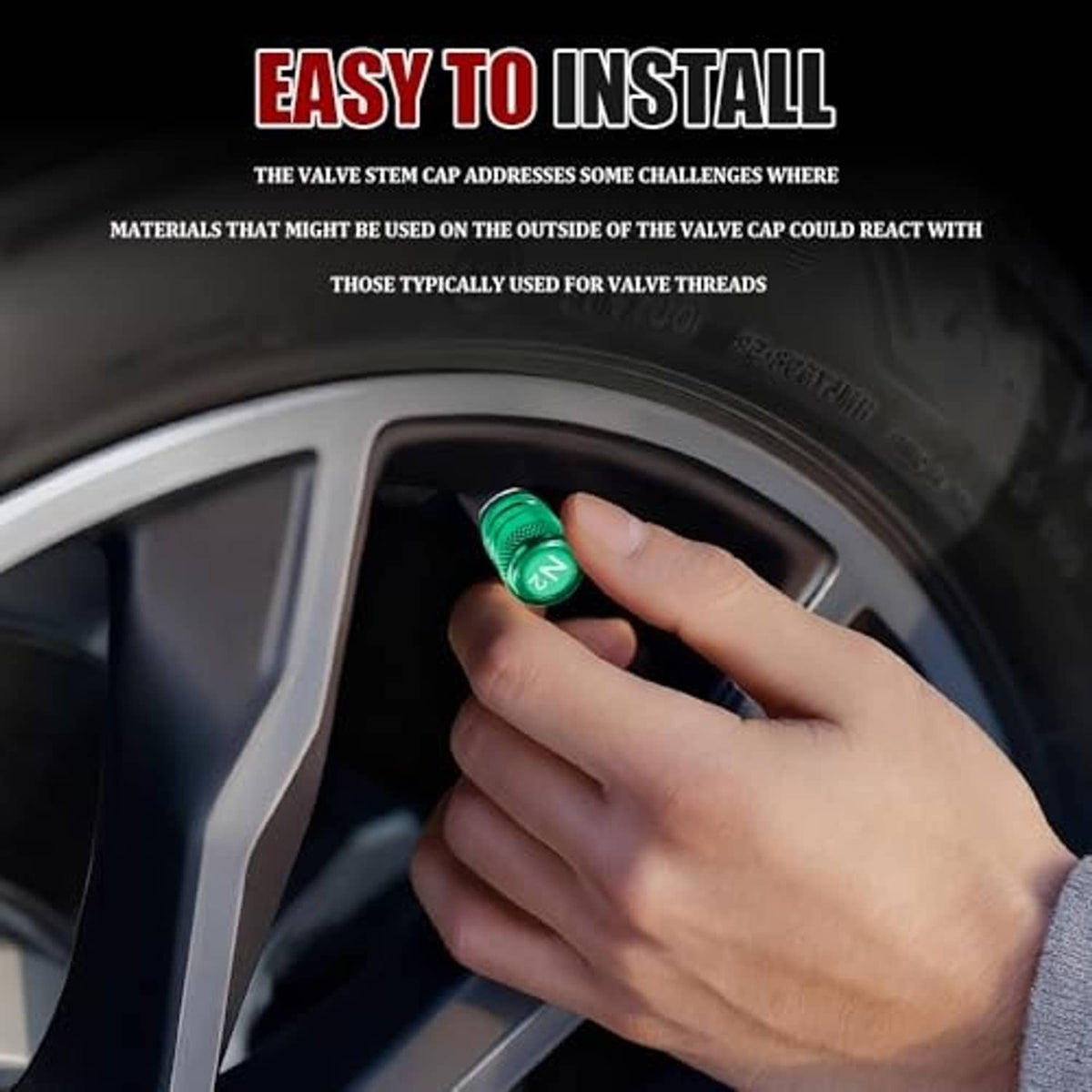 Hand installs a green aluminum tire valve stem cap on a wheel valve stem.