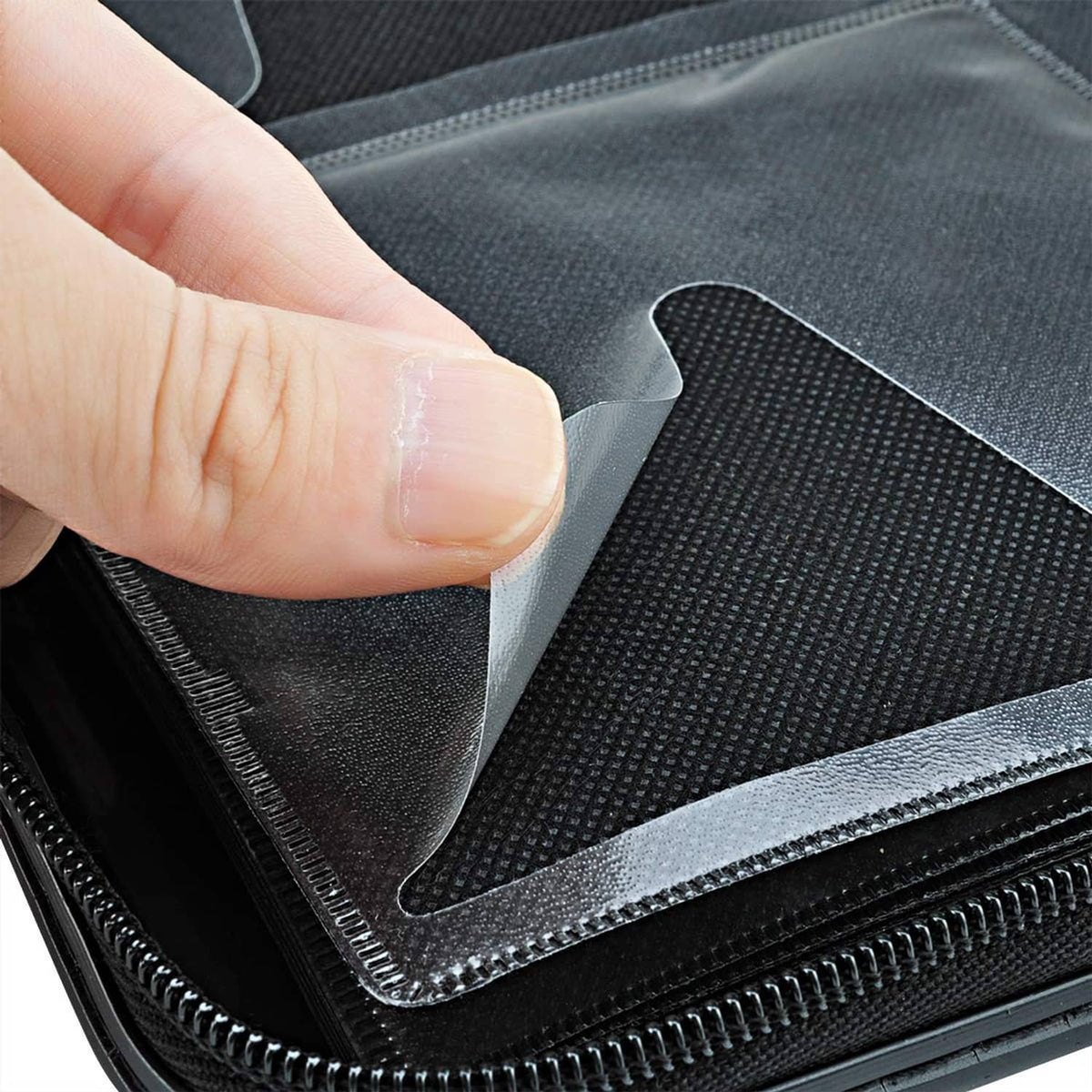 DVD case wallet interior with textured lining and zipper track detail on pocket flap.