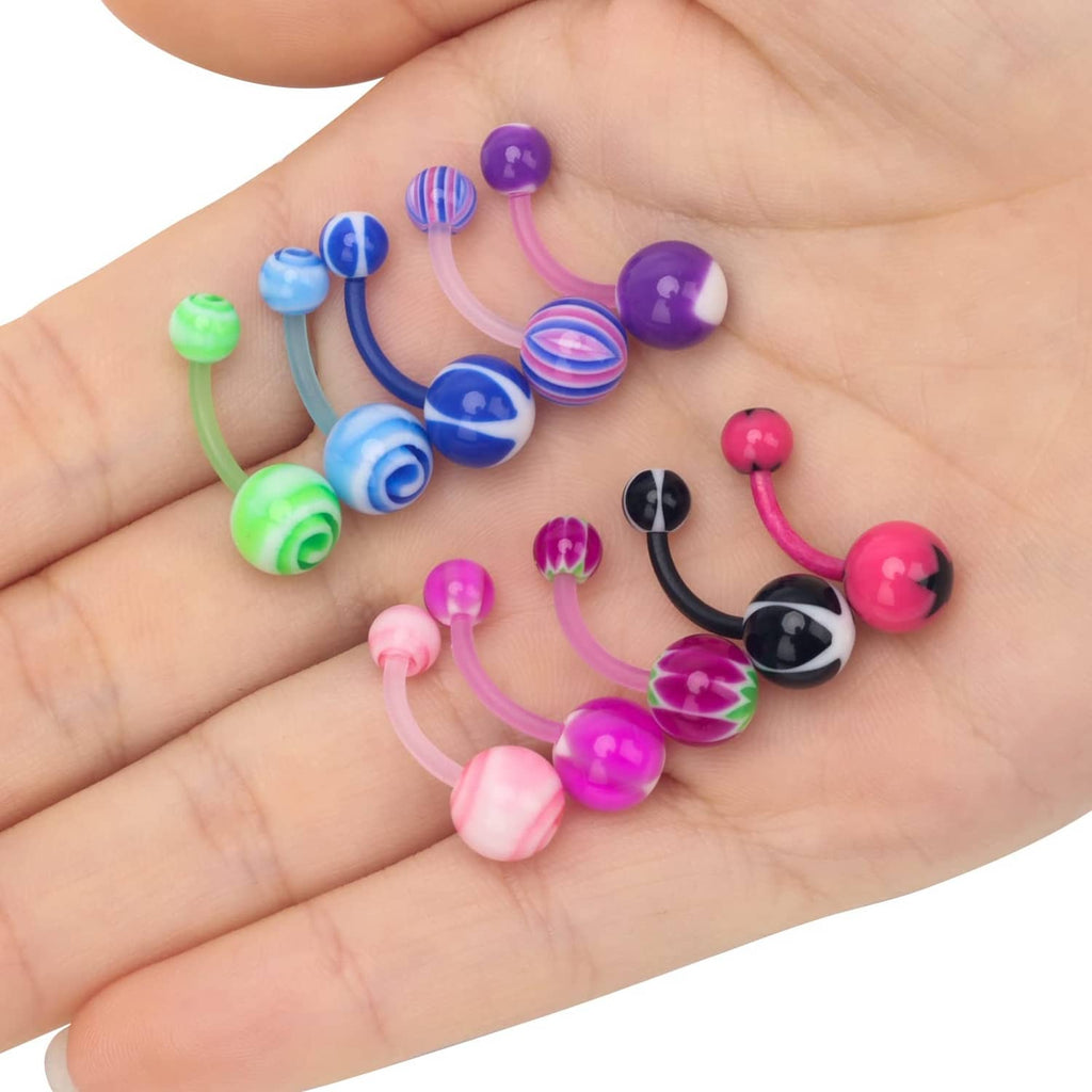 Assorted acrylic tongue rings on open palm, colorful striped and solid ball ends