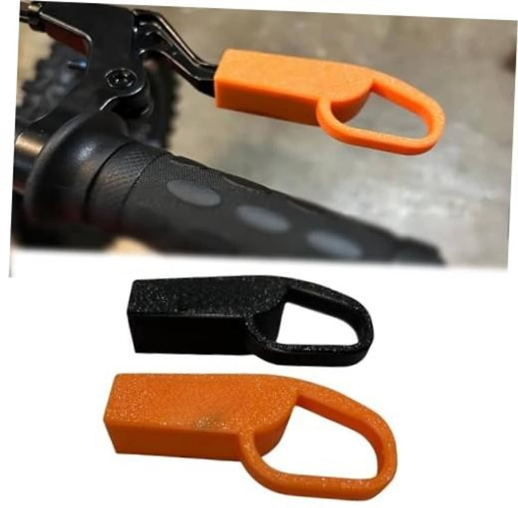 Brake lever extension set with black and orange plastic pieces, each with loop handle