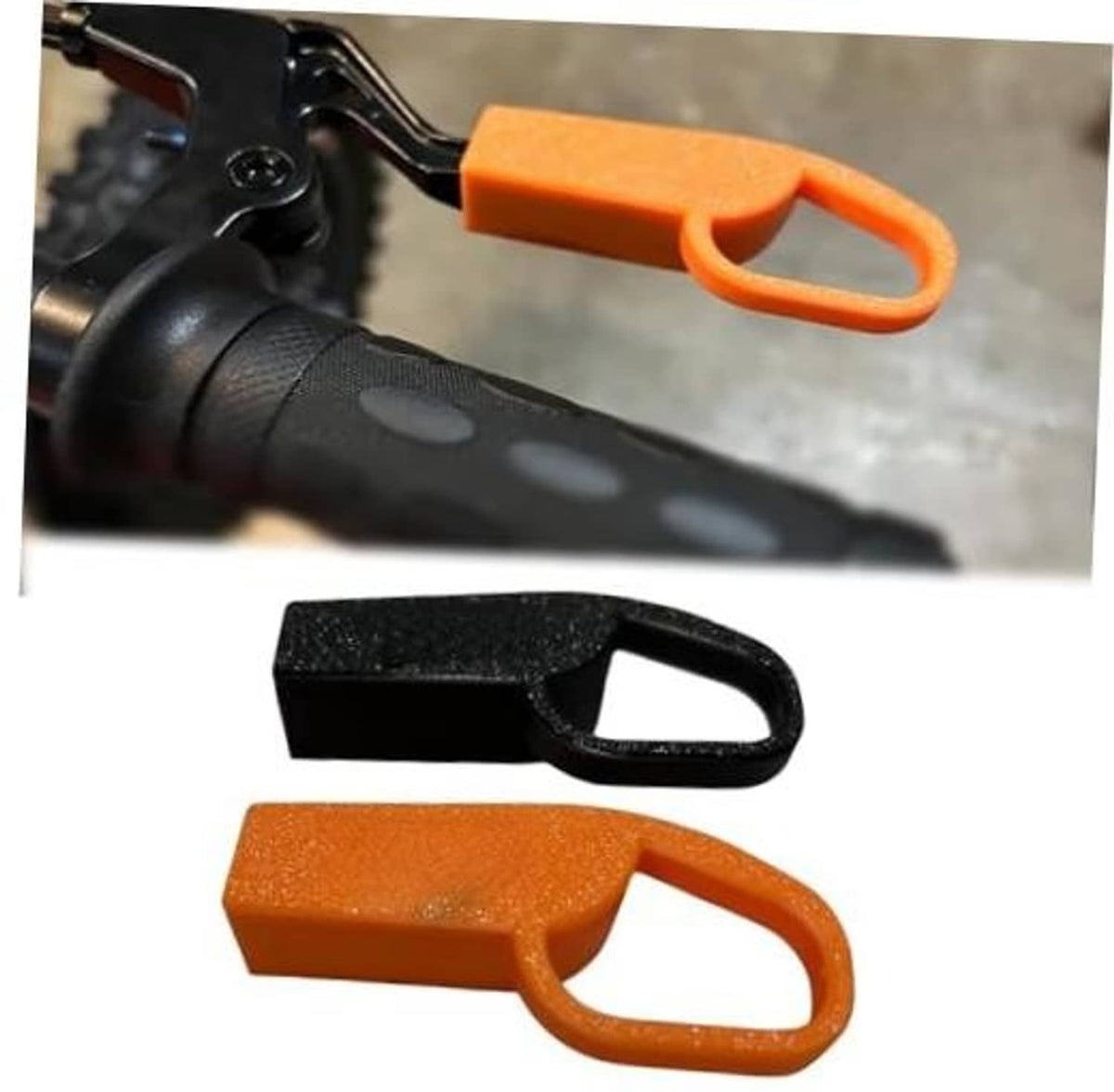 Brake lever extension set with black and orange plastic pieces, each with loop handle