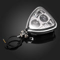 Triangular LED headlight assembly with clear lens, chrome housing, and attached wiring harness