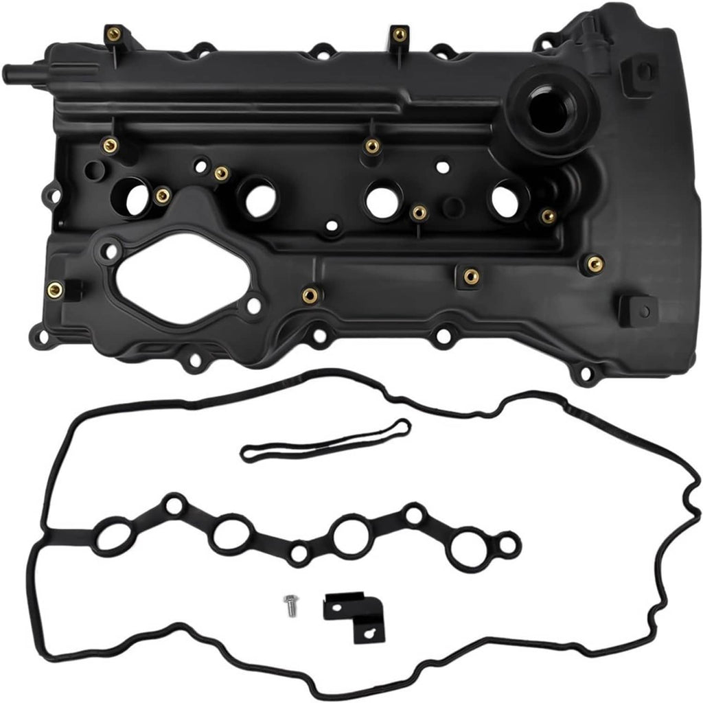 Black valve cover with attached gasket and small gasket pieces, top view.