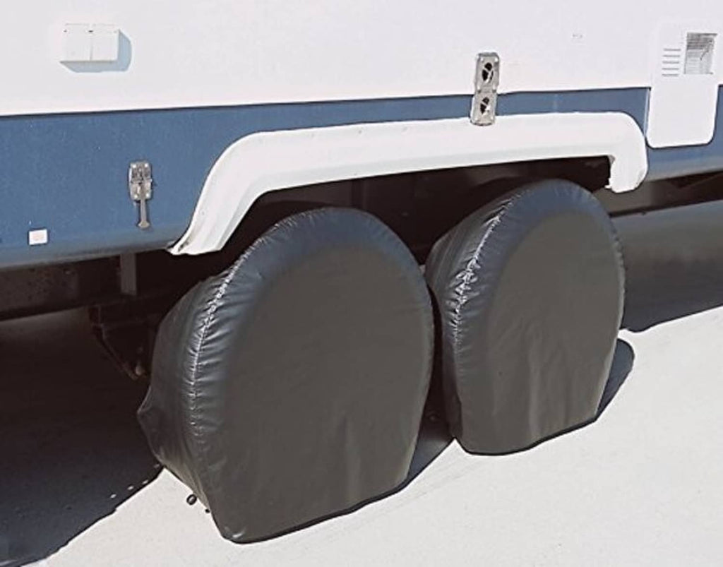 Two rounded grey vinyl tyre guard covers mounted on vehicle