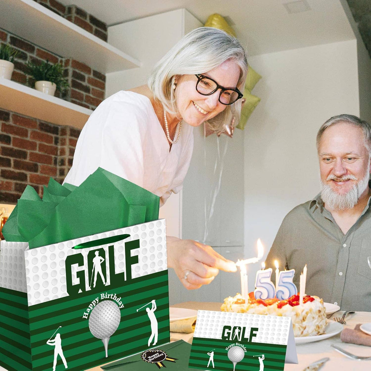 Golf birthday gift bag with tissue paper and matching card by lit cake candles