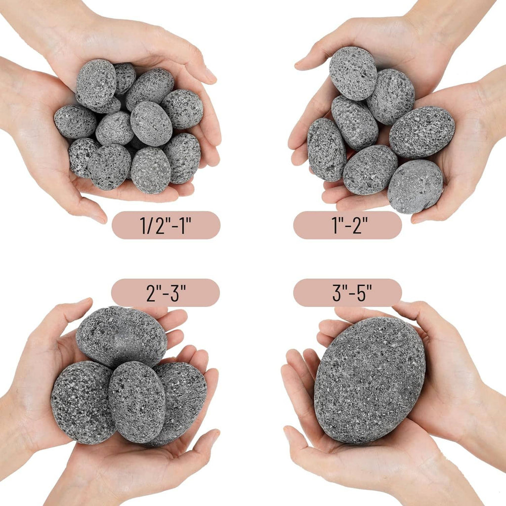 Handful of round black lava rock pebbles, showing pebble sizes