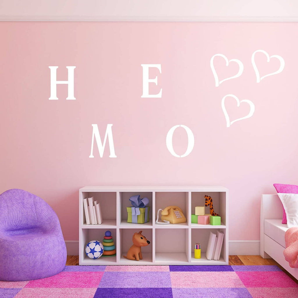 Stencil letters “H E M O” with small heart outlines on a smooth surface