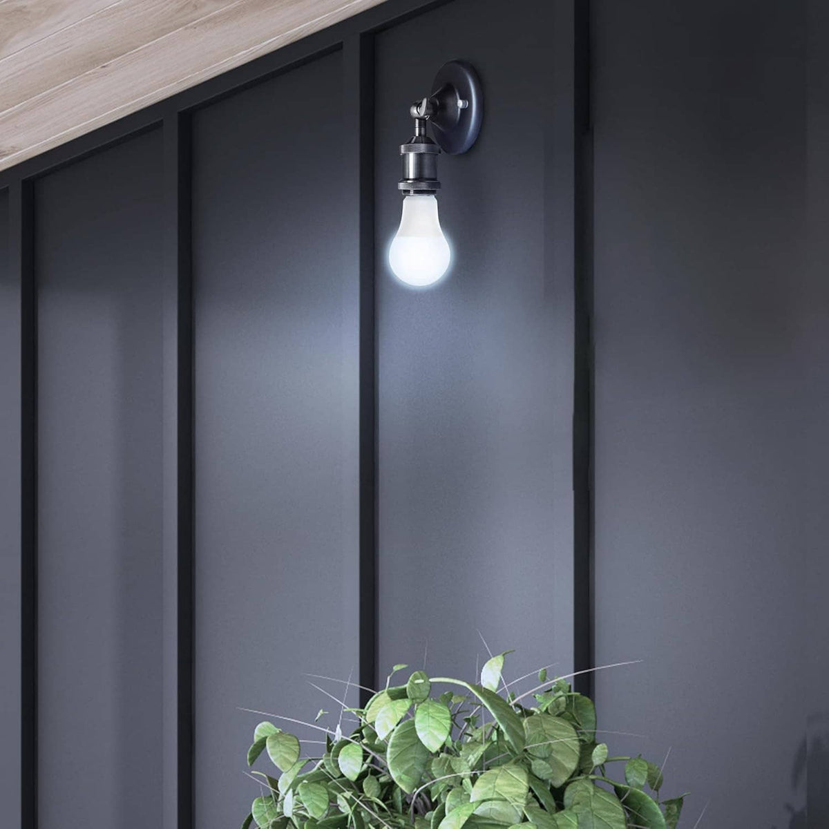 Wall sconce with a glowing LED bulb emitting soft neutral white light.