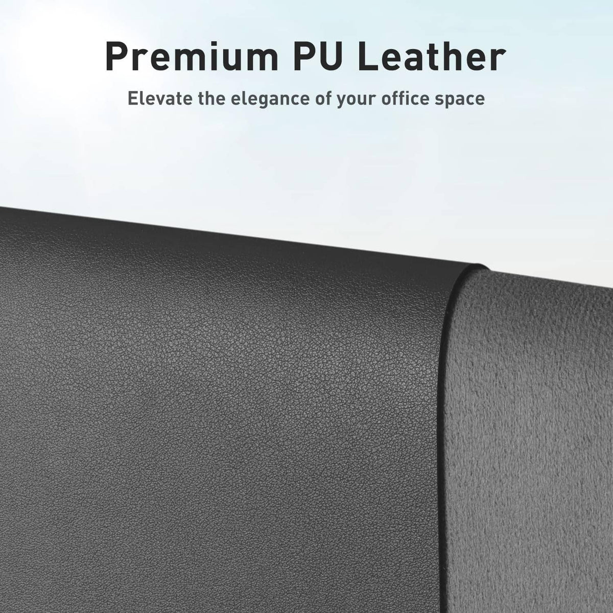 Gray PU leather desk pad with pebbled texture, rolled edge detail