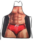 Novelty kitchen apron with black straps and red shorts graphic over bare torso
