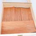 Spanish cedar humidor lining with vertical wood panels in an open box
