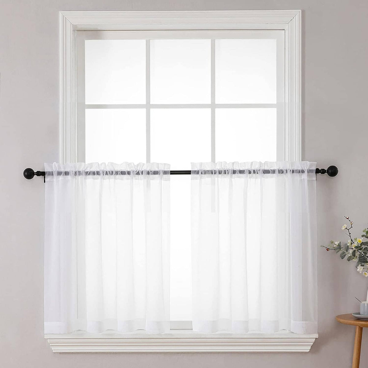 Sheer white curtain panels with vertical folds, light and see-through