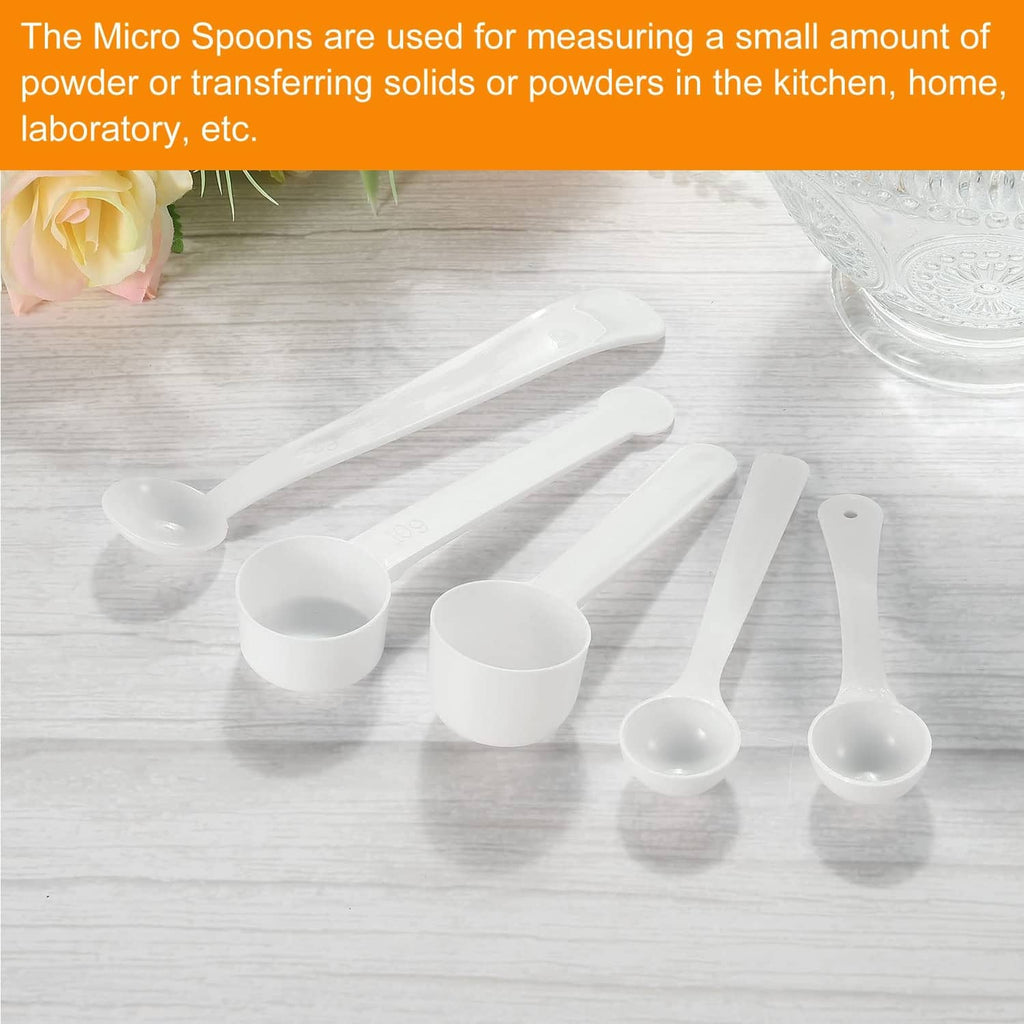 White plastic micro measuring spoons set with round bowls and long handles
