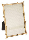 Gold metal picture frame with branch-style corners and light cream 5x7 mat