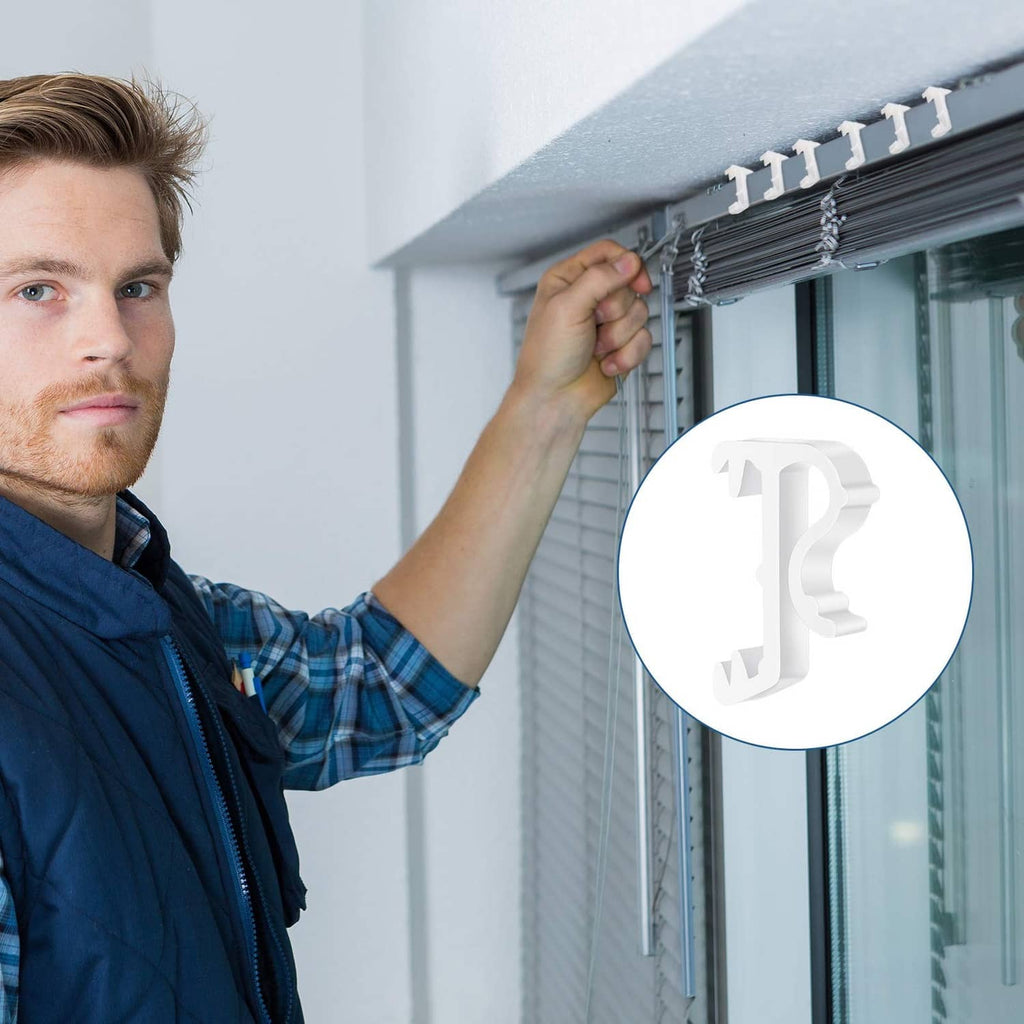 White plastic blind clip holding a window valance