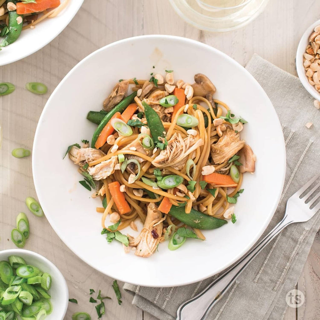 Noodle bowl with vegetables and chicken-like pieces, glazed sauce from Bayou Bourbon