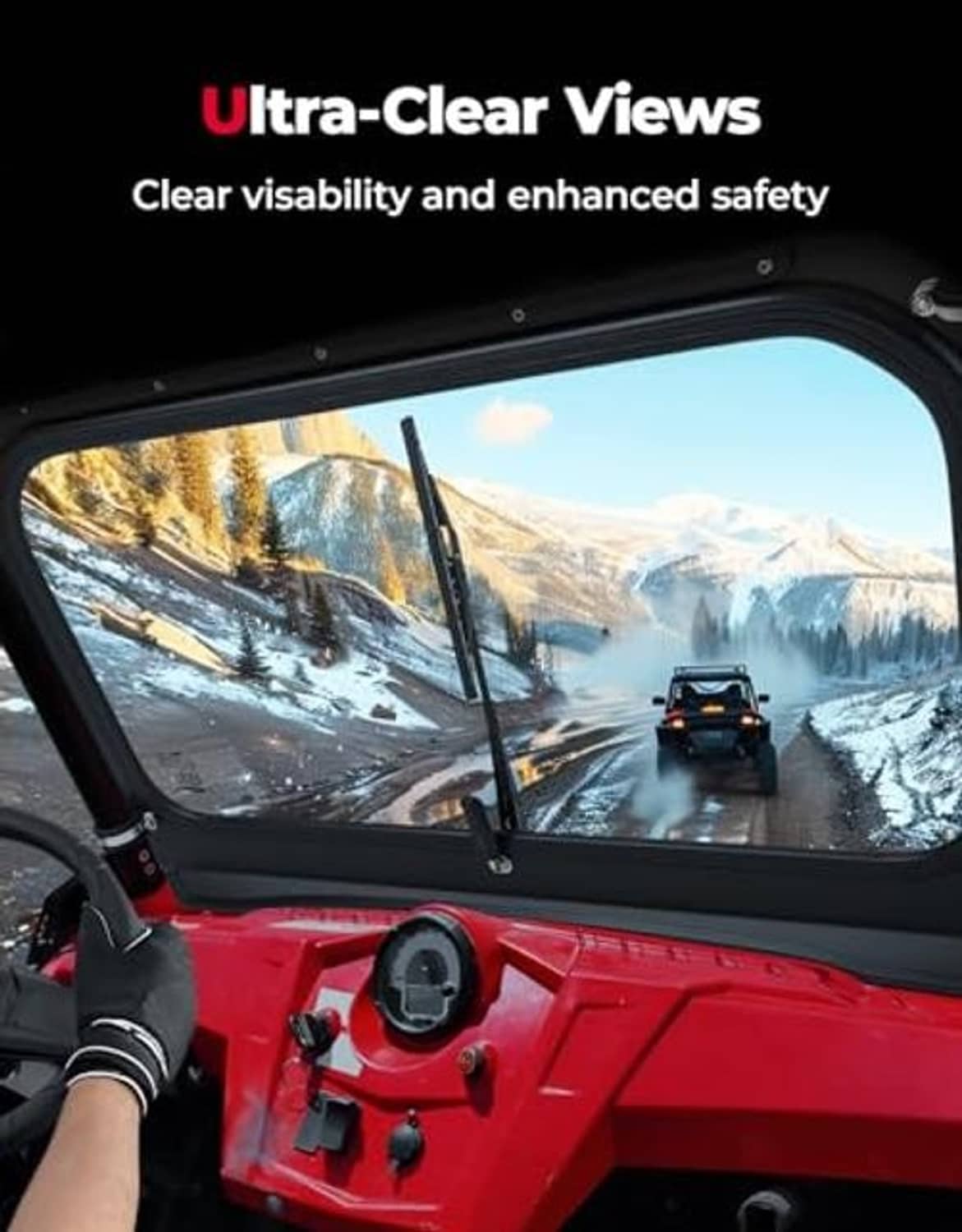 Clear front windshield installed on a red UTV, with black wiper arms and metal frame.