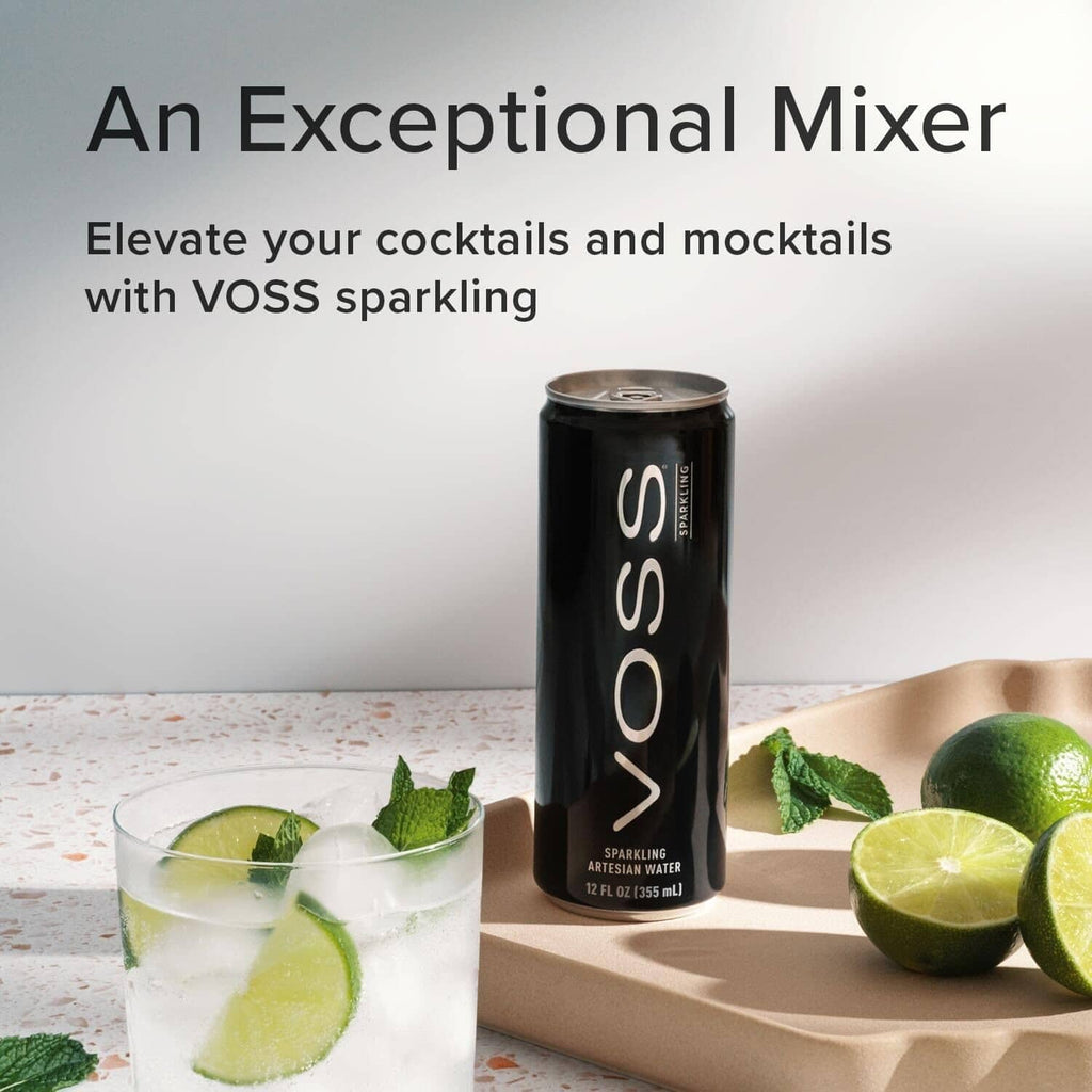 VOSS sparkling water can with lime and mint beside cocktail glass