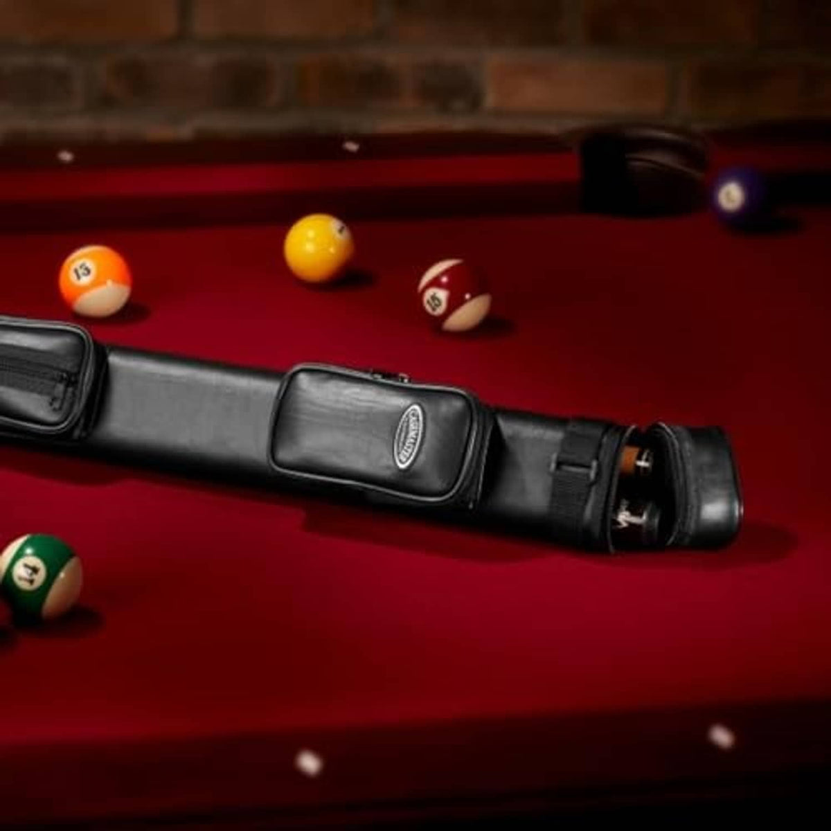 Black hard billiard cue case with pool cue stored inside and end cap
