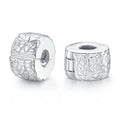 Silver clip spacer charm bead with woven-style cutout pattern, round with center hole
