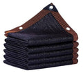 Dark mesh shade tarp, folded stack with brown edge trim and metal grommets