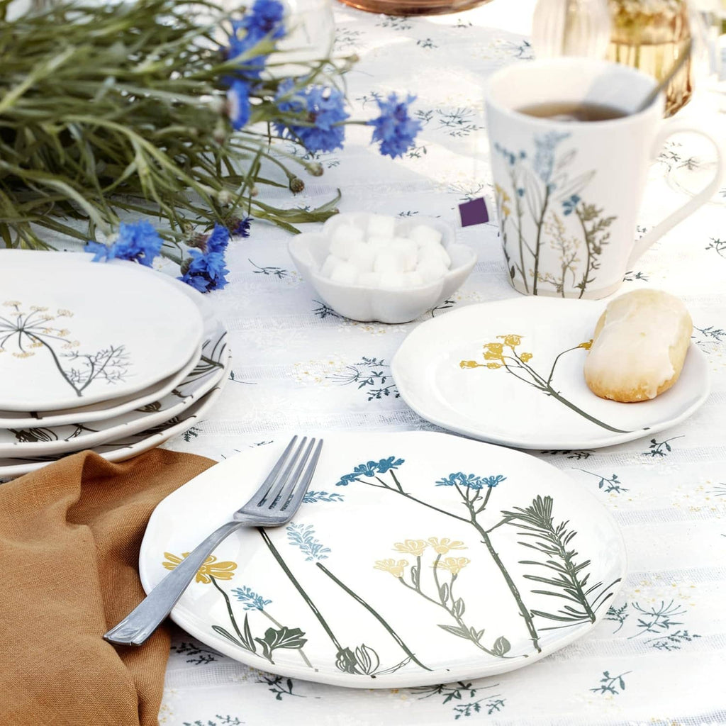 Wildflower tidbit plate with blue and gold botanical print on a table setting