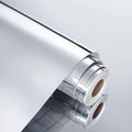 Silver self-adhesive mirror sticker roll with clear backing and reflective surface