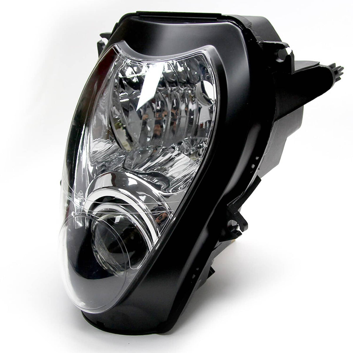 Motorcycle headlight assembly, angled view of clear lens with chrome reflectors