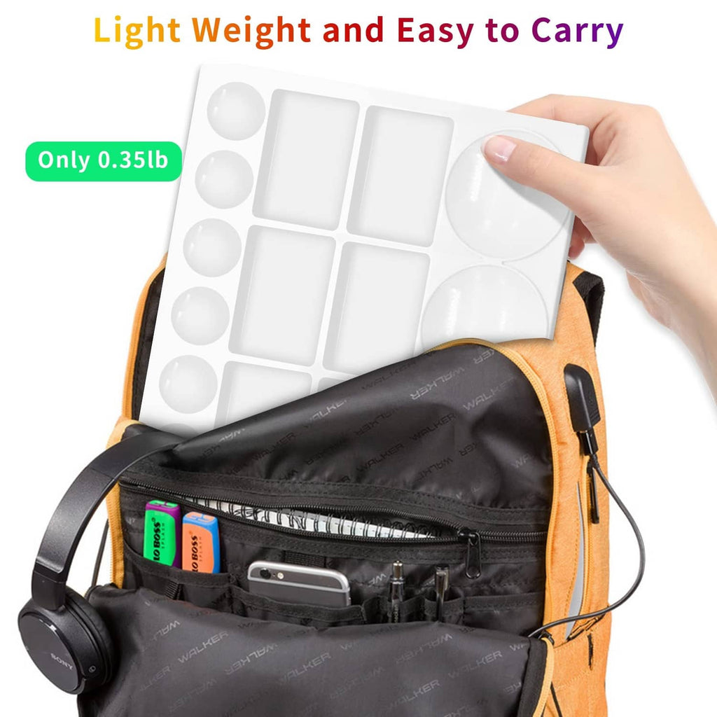 White watercolor paint tray palette with 20 wells, folded for travel in a bag