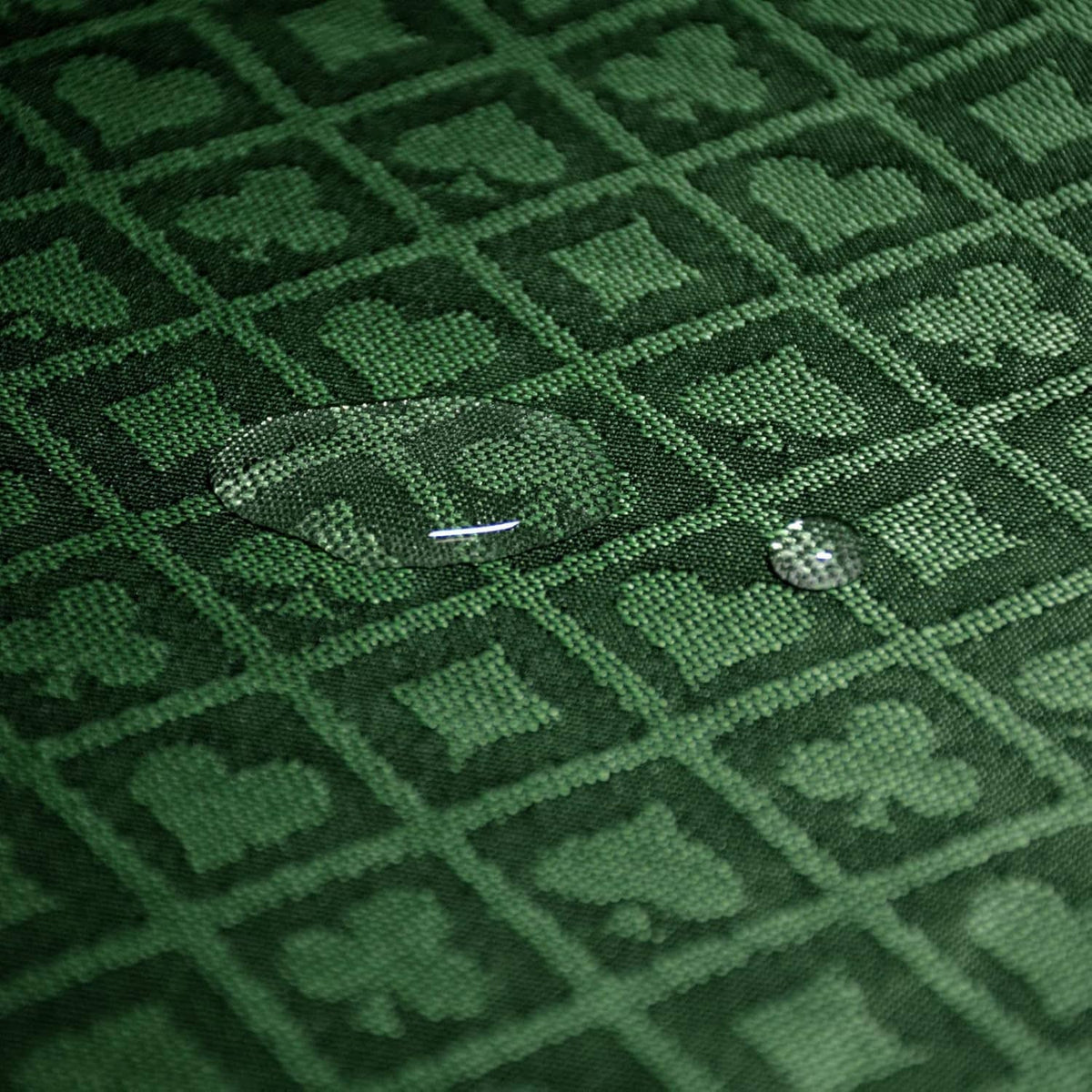 Green poker table speed cloth surface with small stitched detail and diamond pattern