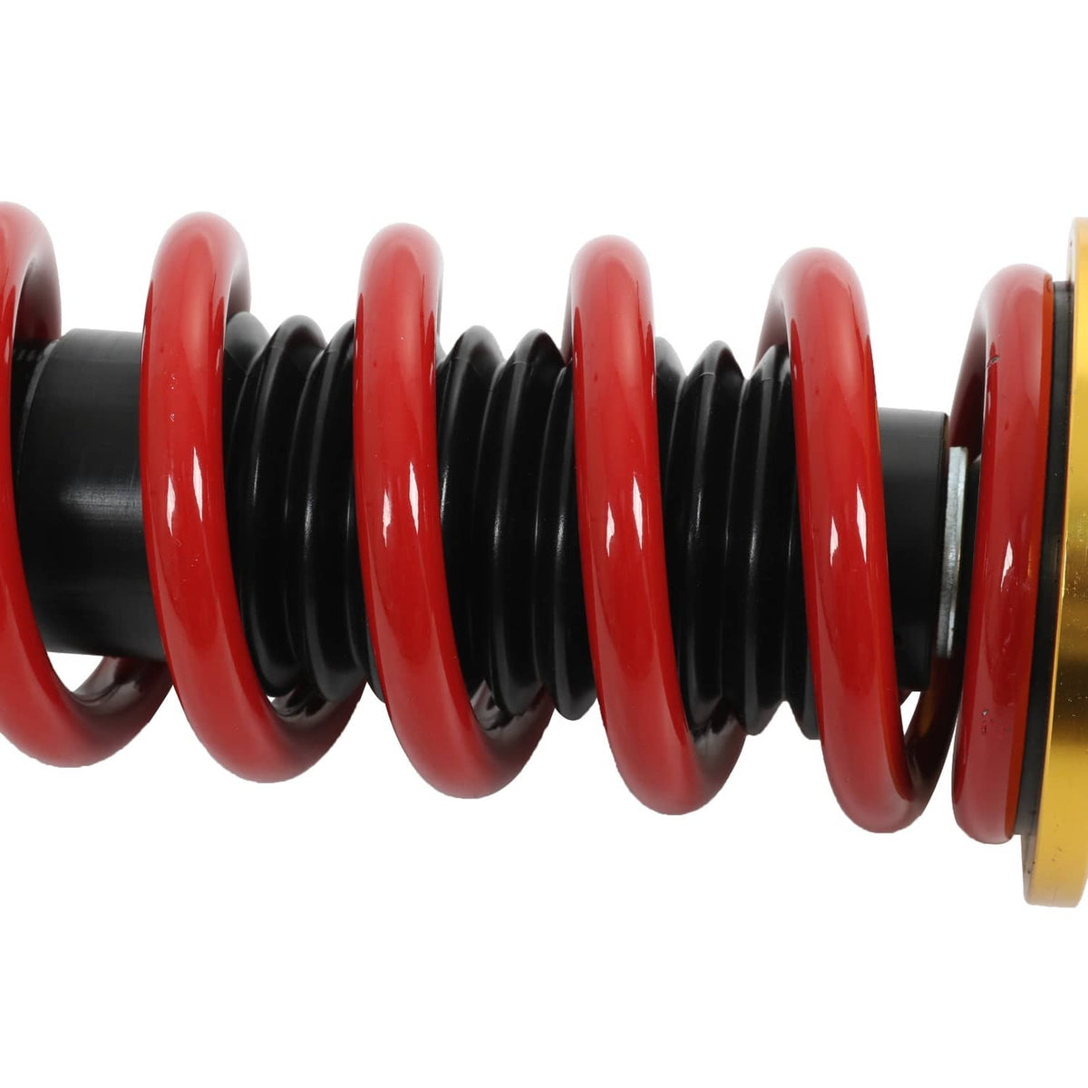Close-up of red coil spring around a black shock body on a coilover