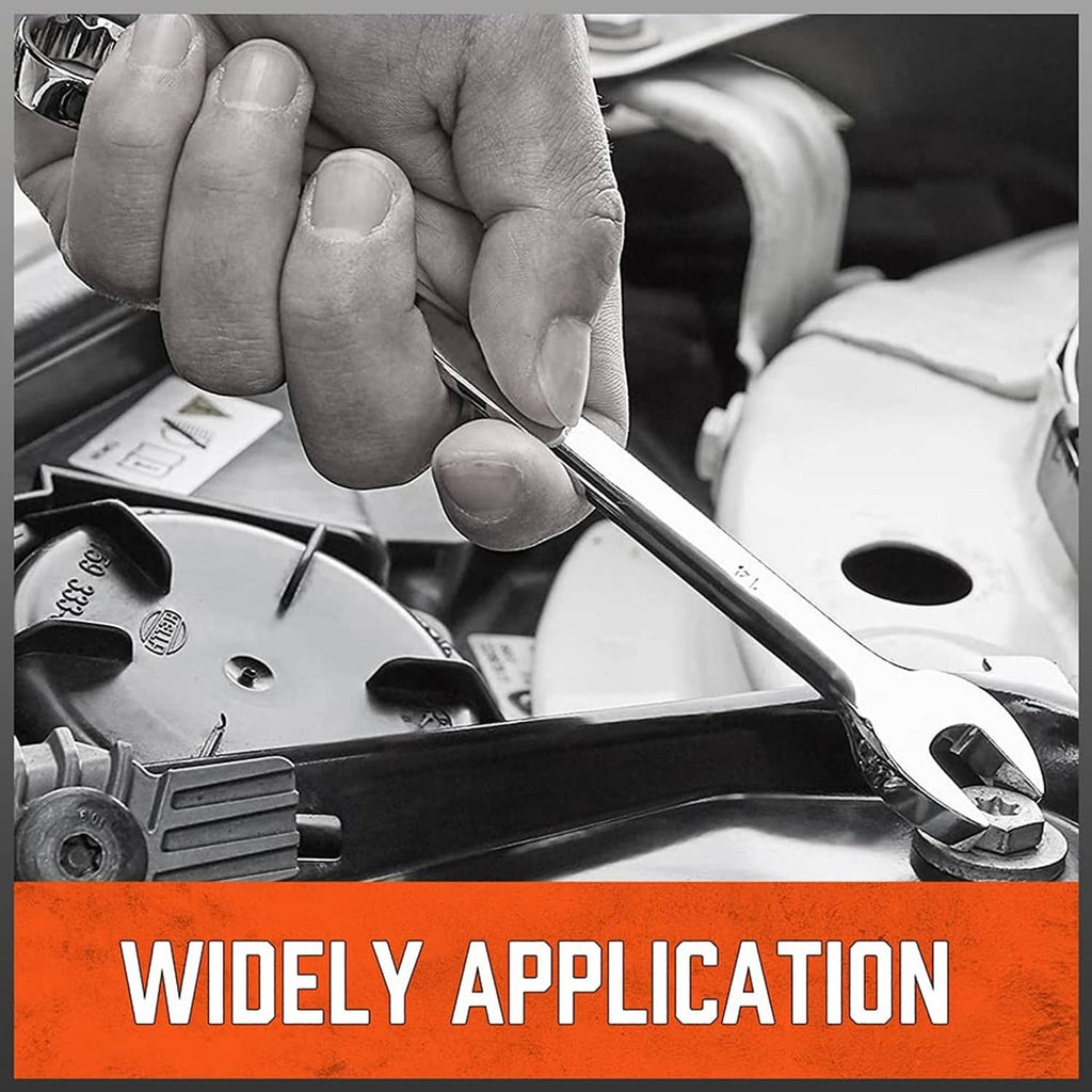 Chrome combination wrench held by hand on an engine part within a tool tray