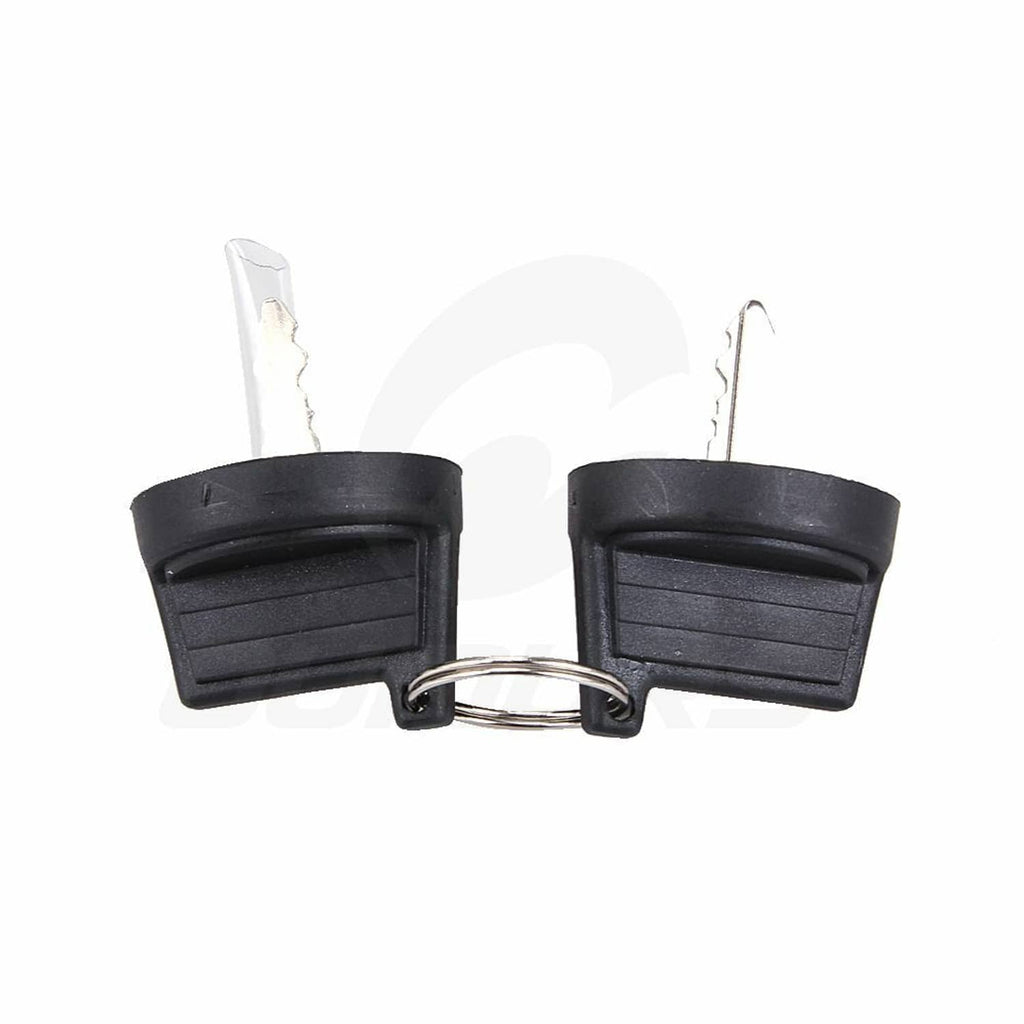 Ignition key switch tumblers: two black key covers with metal keys and return spring clip.