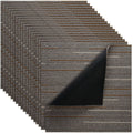 Brown modular carpet tiles with low-profile textured stripe pattern, soft padded feel