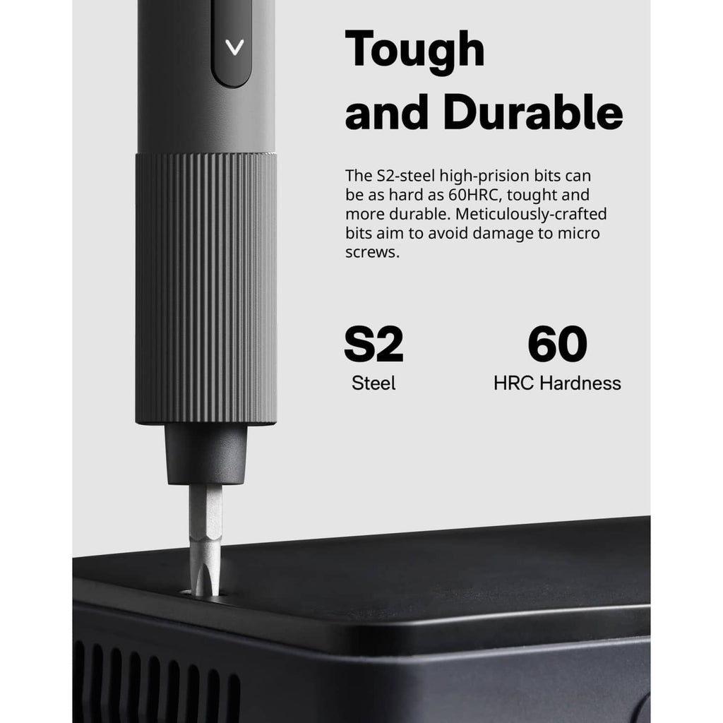 Close-up of precision screwdriver bit and nose tip on a dark surface