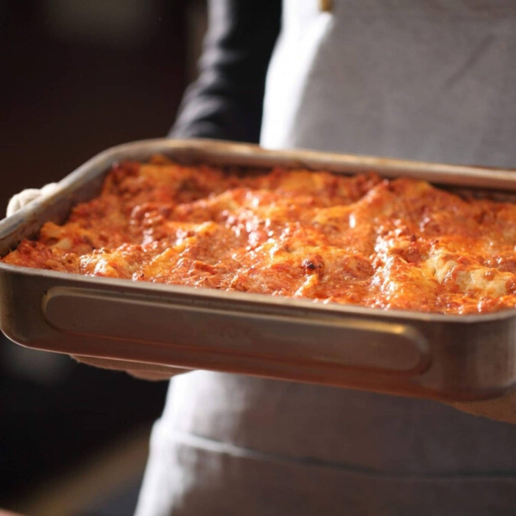 Baked gluten-free lasagna in a rectangular metal tray