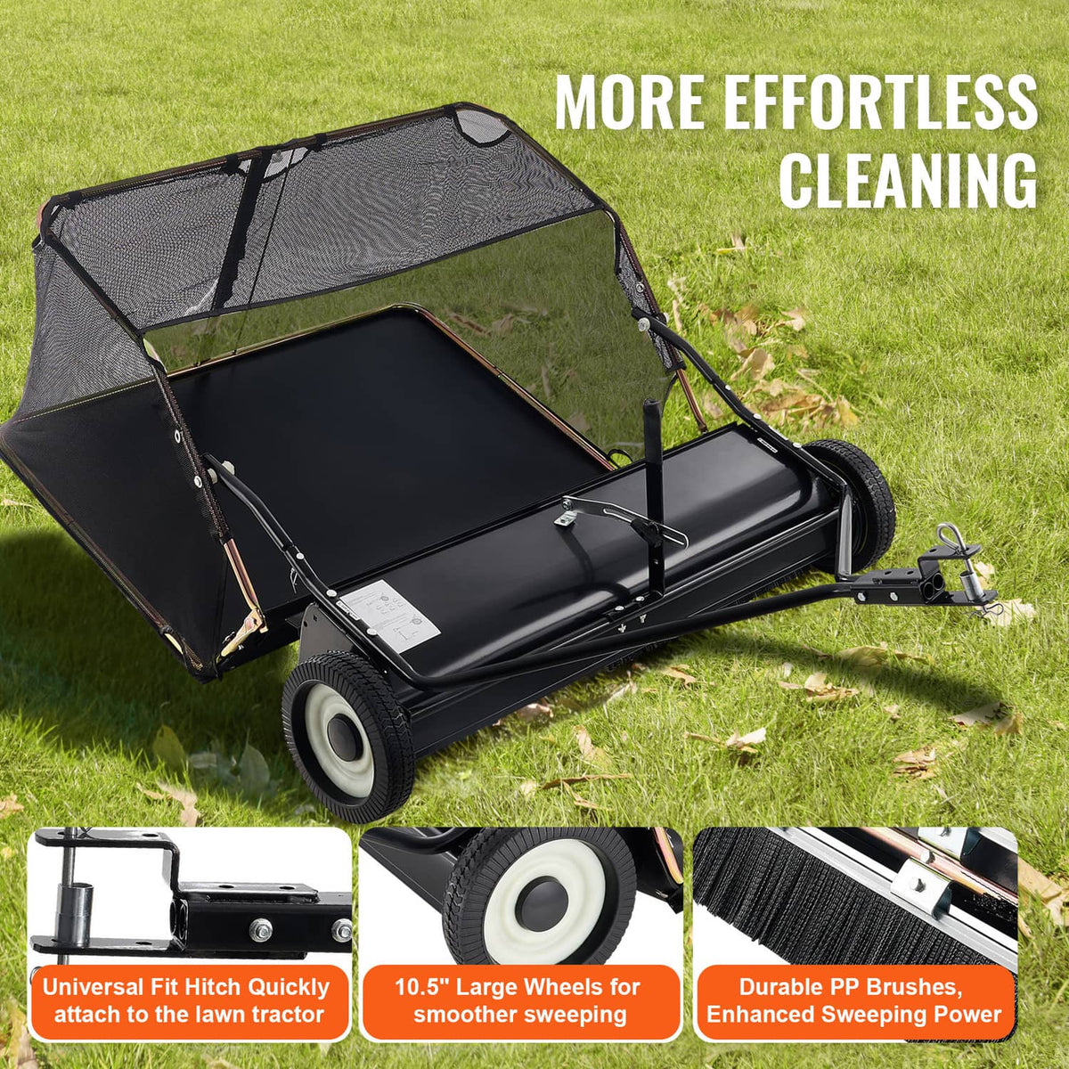 Tow-behind lawn sweeper on grass with black hopper cover and large front wheels