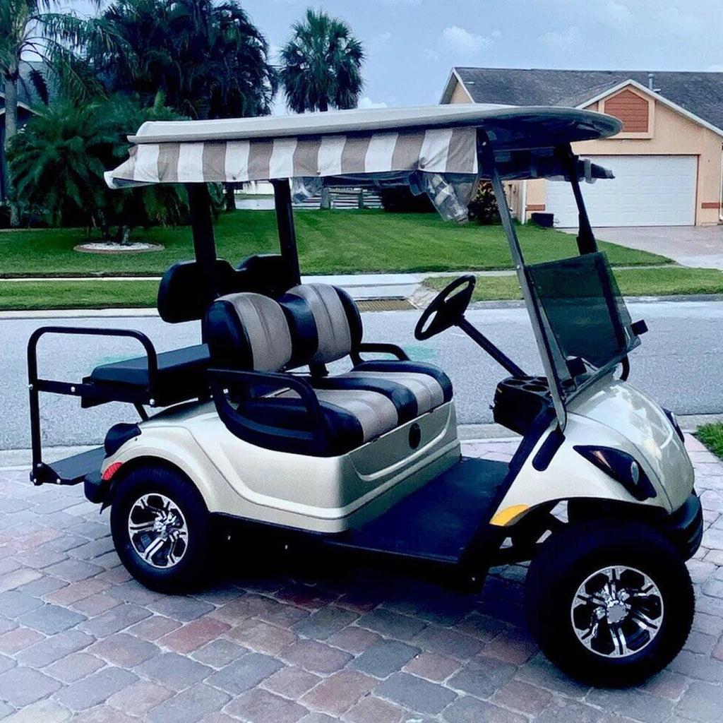 Rear seat kit on golf cart with black frame and dark gray seat and back cushions