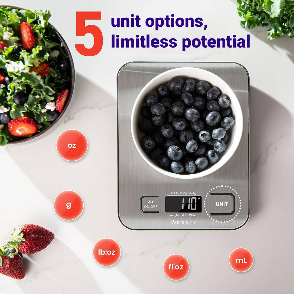 Digital kitchen scale with bowl of blueberries on top and unit option buttons