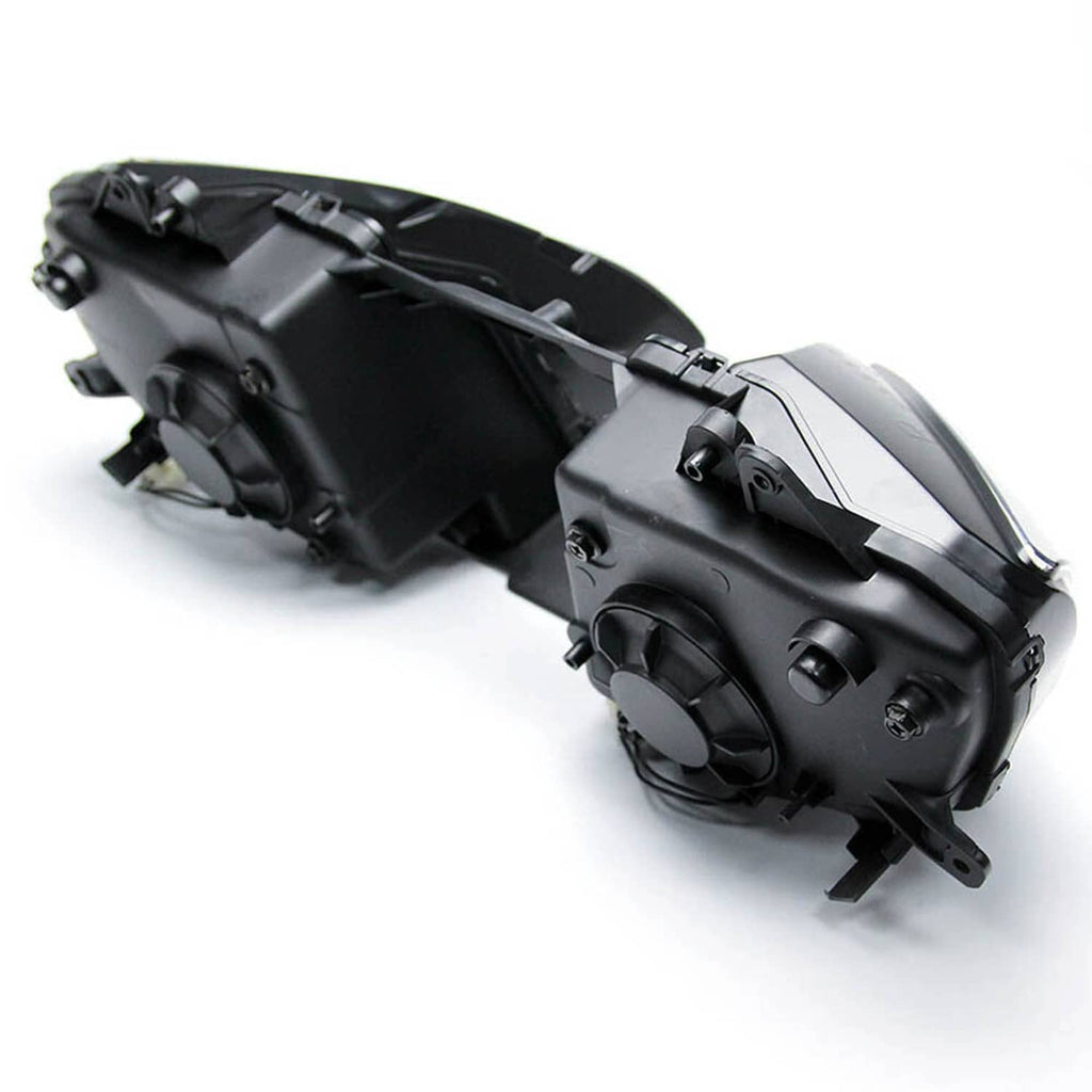 Front headlight assembly side housing with black plastic mounts and clear lens