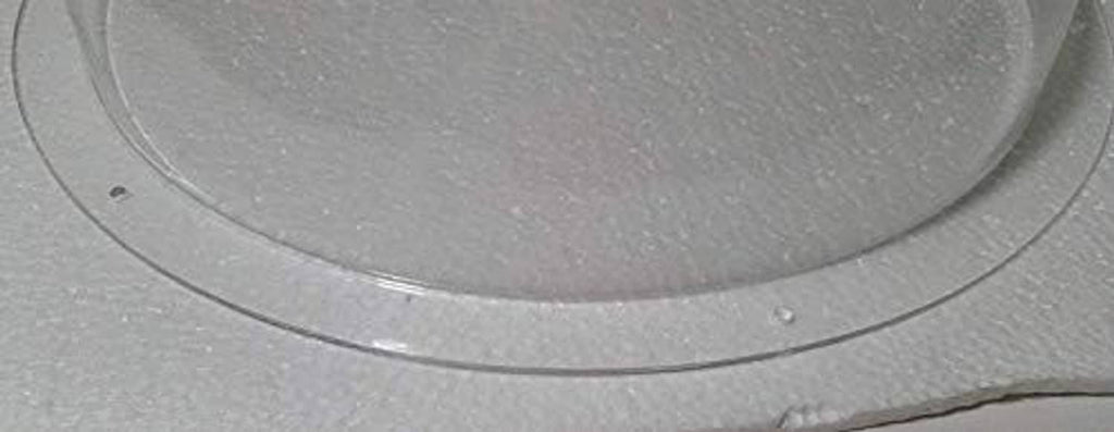 Clear acrylic hemisphere dome edge with smooth curved lip and transparent finish.