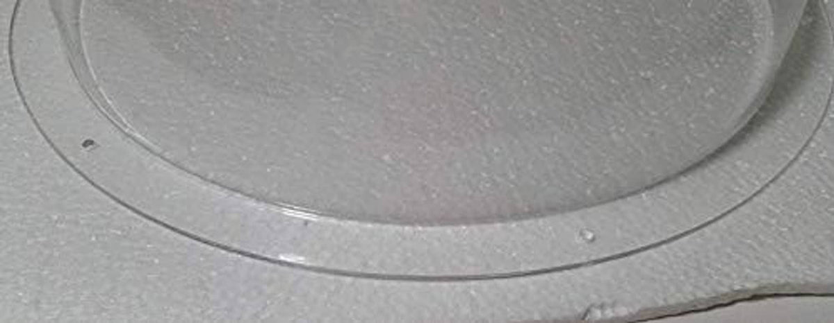 Clear acrylic hemisphere dome edge with smooth curved lip and transparent finish.