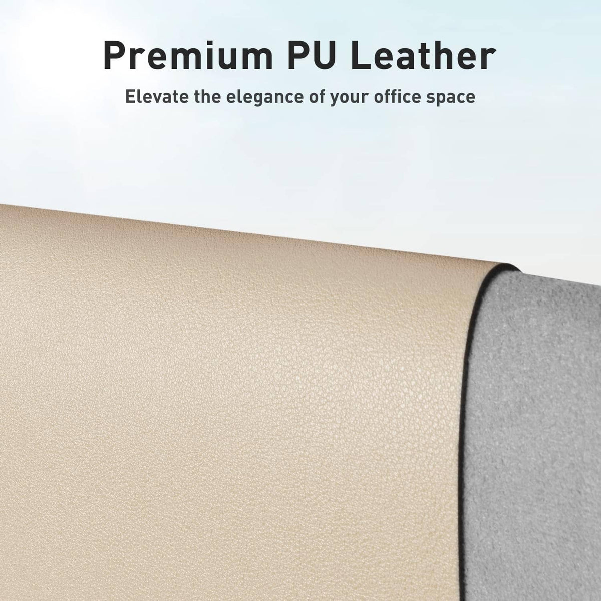 Beige leather desk pad edge with textured surface and dark gray backing