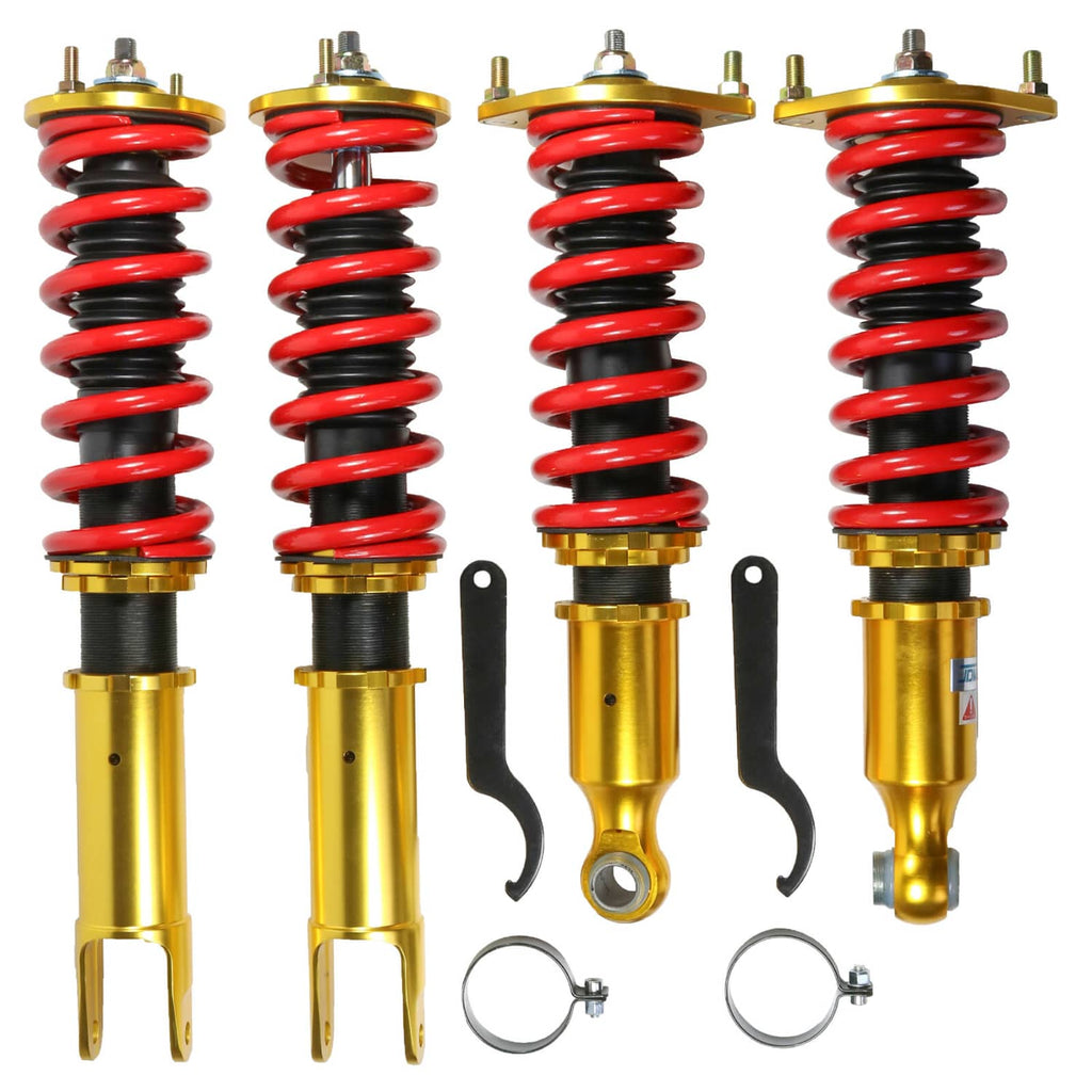 Gold coilover strut shocks with red coil springs and adjustable top mounts