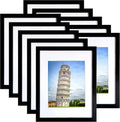 Black picture frame set with white mat, showing a small photo opening.