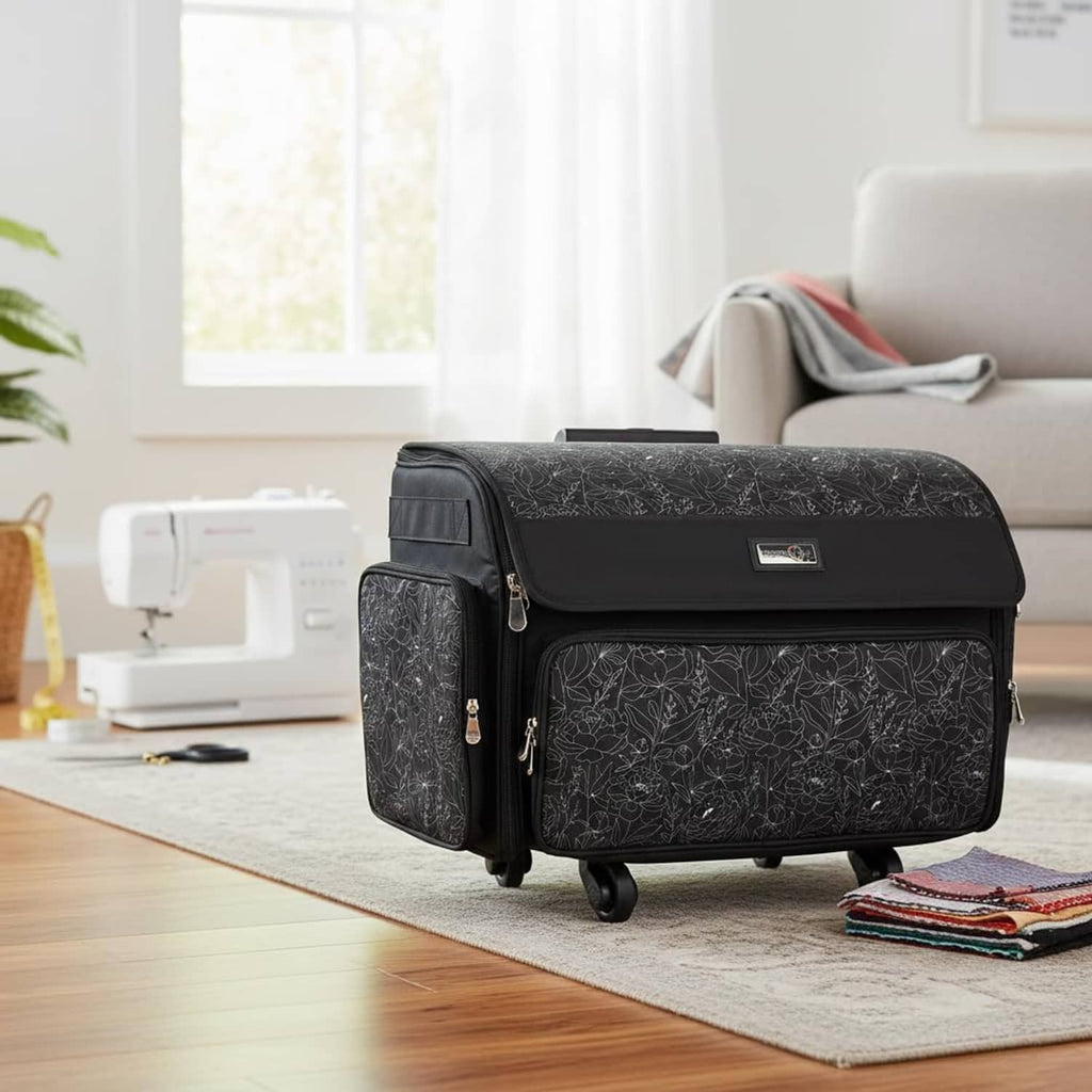 Rolling sewing machine storage case on wheels, black patterned design with side carry handles