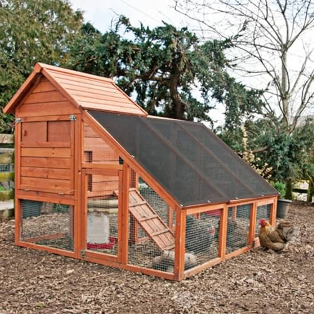 Dog kennel with dark shade cloth cover installed on the roof