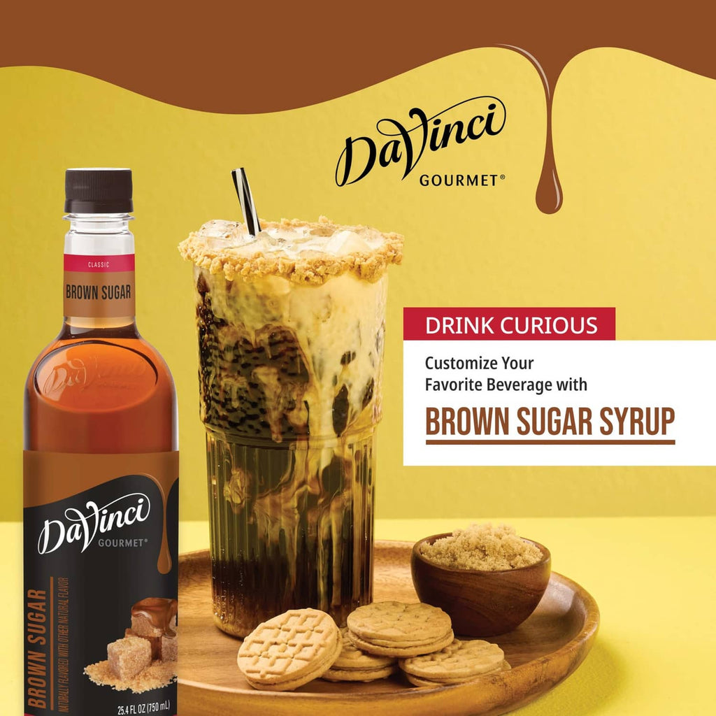 Brown sugar syrup bottle with iced drink, cookies, and brown sugar pieces
